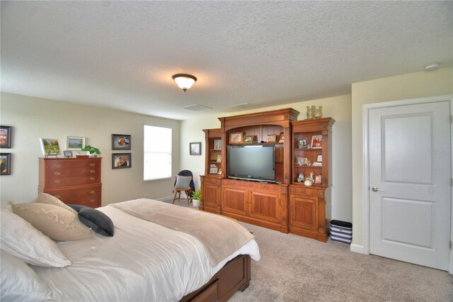 1433 Bunker Dr, Davenport, FL 33896 - bedroom with carpet floors and a textured ceiling
