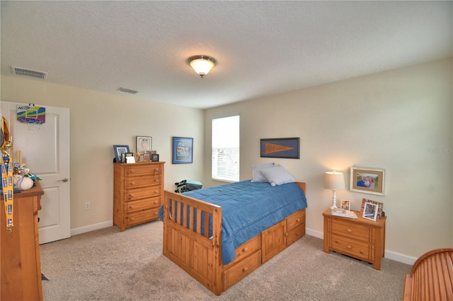 1433 Bunker Dr, Davenport, FL 33896 - bedroom featuring light carpet, a textured ceiling, and baseboards