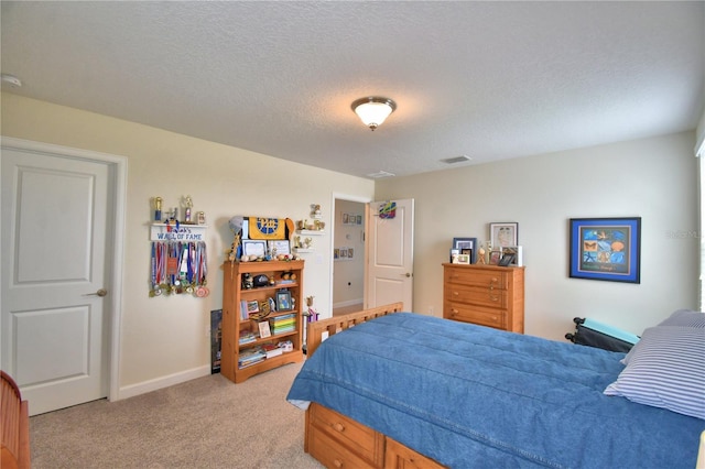 1433 Bunker Dr, Davenport, FL 33896 - bedroom with light carpet, a textured ceiling, and baseboards