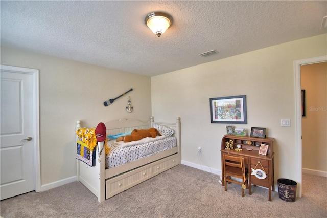 1433 Bunker Dr, Davenport, FL 33896 - carpeted bedroom with a textured ceiling and baseboards