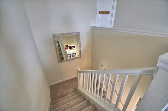 1433 Bunker Dr, Davenport, FL 33896 - staircase featuring carpet floors and baseboards