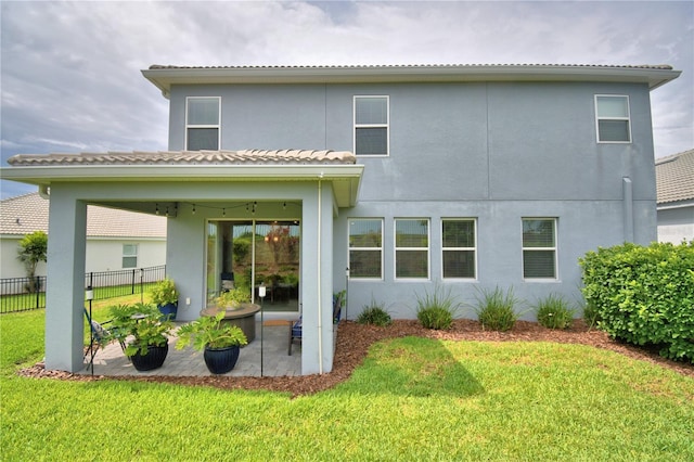 1433 Bunker Dr, Davenport, FL 33896 - back of property with a patio area, stucco siding, and a tile roof