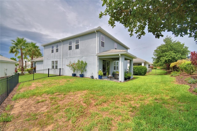 1433 Bunker Dr, Davenport, FL 33896 - back of house with stucco siding and a patio area