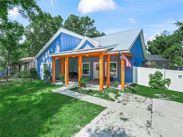 7714 Chase Rd, Lakeland, FL 33810 - view of front of property featuring metal roof and a patio