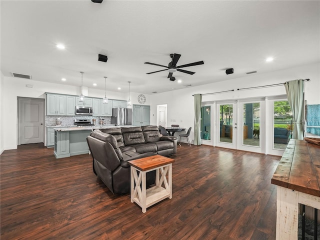 7714 Chase Rd, Lakeland, FL 33810 - living area with recessed lighting, a ceiling fan, french doors, and dark wood-style flooring