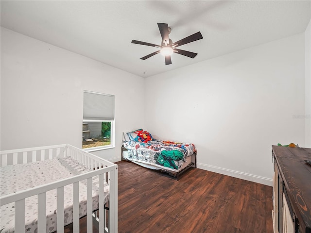7714 Chase Rd, Lakeland, FL 33810 - bedroom featuring dark wood-style flooring, baseboards, and a ceiling fan