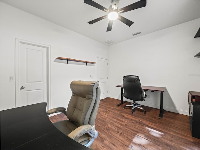 7714 Chase Rd, Lakeland, FL 33810 - home office featuring ceiling fan, wood finished floors, and baseboards