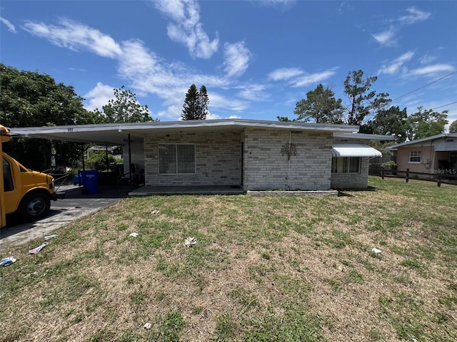 507 Ave H SE, Winter Haven, FL 33880 - back of house featuring a carport