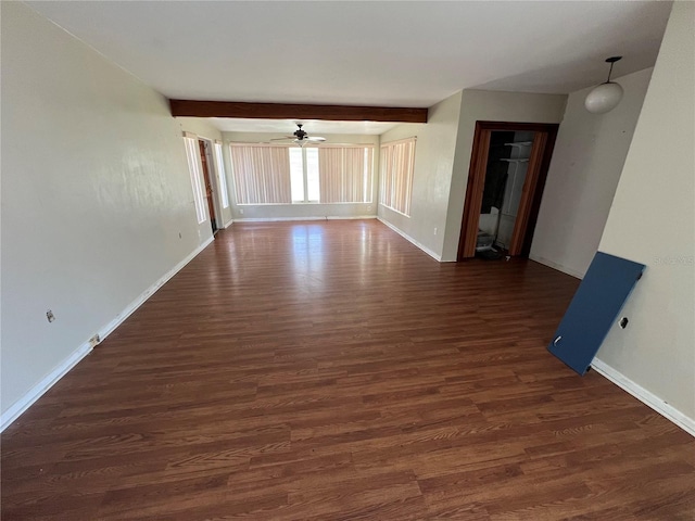 507 Ave H SE, Winter Haven, FL 33880 - unfurnished room featuring ceiling fan, dark wood-style floors, baseboards, and beamed ceiling