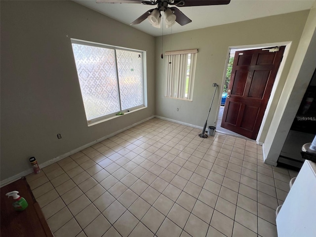 507 Ave H SE, Winter Haven, FL 33880 - entryway featuring ceiling fan, baseboards, light tile patterned flooring, and vaulted ceiling