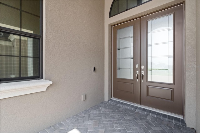 209 Pine Lilly Ct, Lake Alfred, FL 33850 - entrance to property featuring french doors and stucco siding