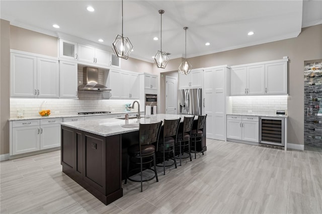 209 Pine Lilly Ct, Lake Alfred, FL 33850 - kitchen featuring beverage cooler, wall chimney exhaust hood, decorative backsplash, a sink, and a kitchen breakfast bar