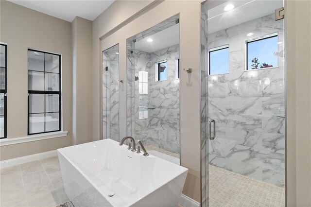 209 Pine Lilly Ct, Lake Alfred, FL 33850 - full bathroom featuring a freestanding tub, a marble finish shower, and baseboards