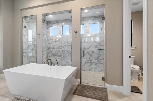 209 Pine Lilly Ct, Lake Alfred, FL 33850 - bathroom featuring a soaking tub, toilet, a marble finish shower, and baseboards