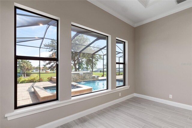 209 Pine Lilly Ct, Lake Alfred, FL 33850 - unfurnished room with baseboards, ornamental molding, and healthy amount of natural light