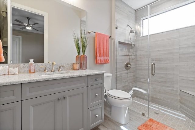 209 Pine Lilly Ct, Lake Alfred, FL 33850 - full bath with vanity, a stall shower, ceiling fan, and toilet