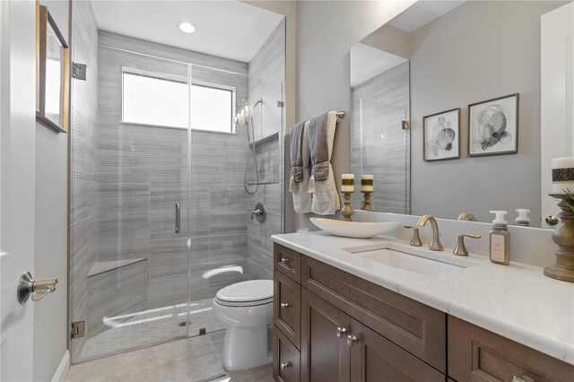 209 Pine Lilly Ct, Lake Alfred, FL 33850 - bathroom featuring toilet, vanity, a stall shower, tile patterned floors, and recessed lighting
