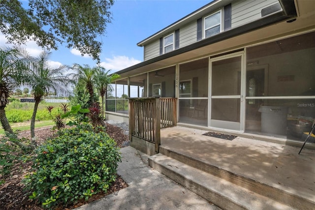 1256 Center St, Dundee, FL 33838 - view of property exterior featuring a sunroom