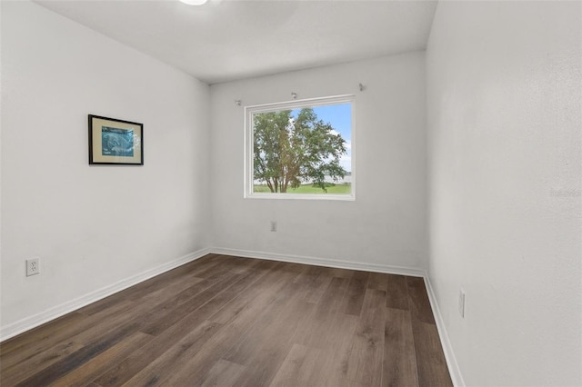 1256 Center St, Dundee, FL 33838 - unfurnished room with dark wood-style flooring and baseboards