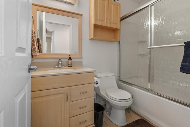 1256 Center St, Dundee, FL 33838 - full bath with vanity, toilet, shower / bath combination with glass door, and tile patterned floors