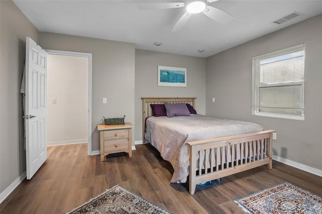 1256 Center St, Dundee, FL 33838 - bedroom with wood finished floors, baseboards, and a ceiling fan
