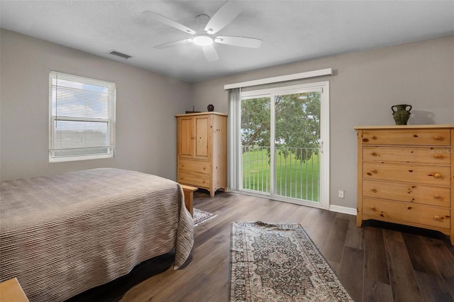 1256 Center St, Dundee, FL 33838 - bedroom with access to outside, wood finished floors, ceiling fan, and baseboards