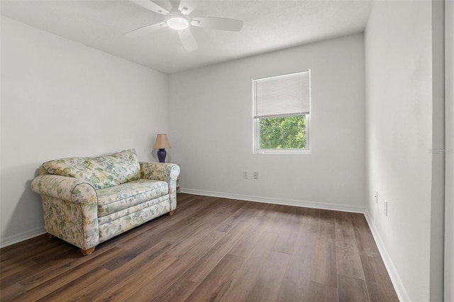 1256 Center St, Dundee, FL 33838 - living area featuring wood finished floors, ceiling fan, and baseboards
