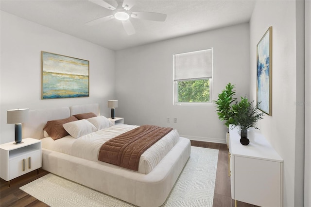 1256 Center St, Dundee, FL 33838 - bedroom featuring dark wood-style floors, baseboards, and a ceiling fan