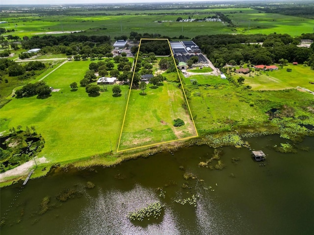 1256 Center St, Dundee, FL 33838 - aerial view of sparsely populated area with property boundaries highlighted and a large body of water