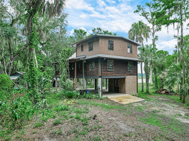 2530 Arbuckle Shores Rd, Frostproof, FL 33843 - back of property featuring driveway and a carport