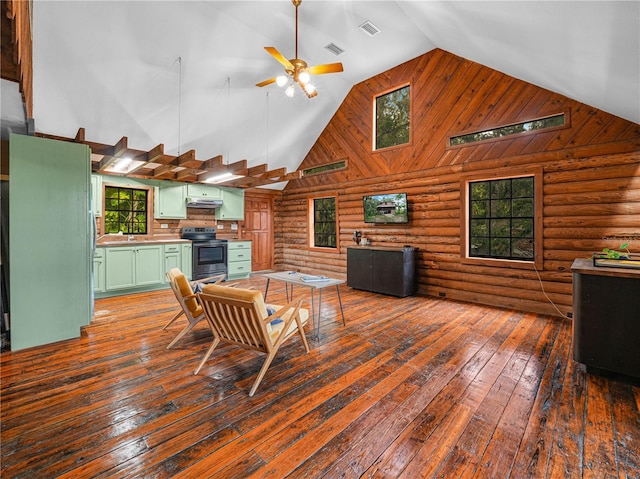 2530 Arbuckle Shores Rd, Frostproof, FL 33843 - living area with rustic walls, high vaulted ceiling, a ceiling fan, and dark wood-style floors