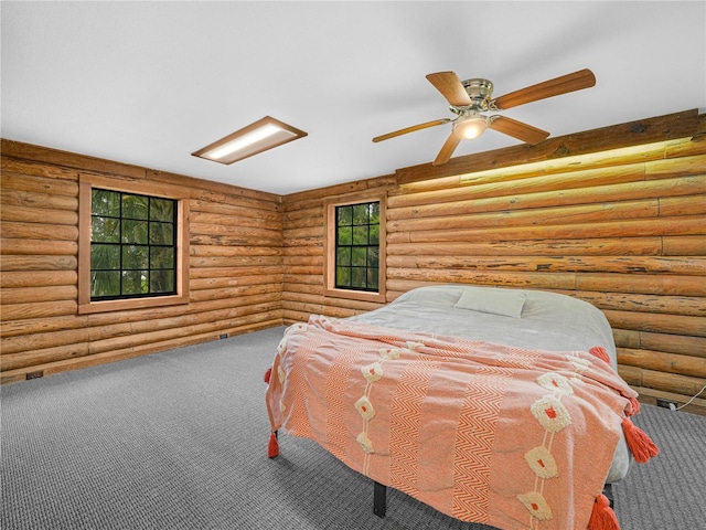 2530 Arbuckle Shores Rd, Frostproof, FL 33843 - bedroom featuring carpet flooring, log walls, and ceiling fan