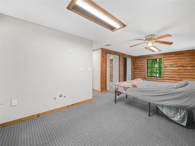 2530 Arbuckle Shores Rd, Frostproof, FL 33843 - carpeted bedroom featuring rustic walls, baseboards, and ceiling fan