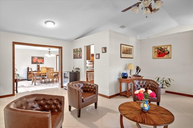 1273 Scrub Jay Trl, Frostproof, FL 33843 - living room with lofted ceiling, ceiling fan, a chandelier, and light tile patterned floors