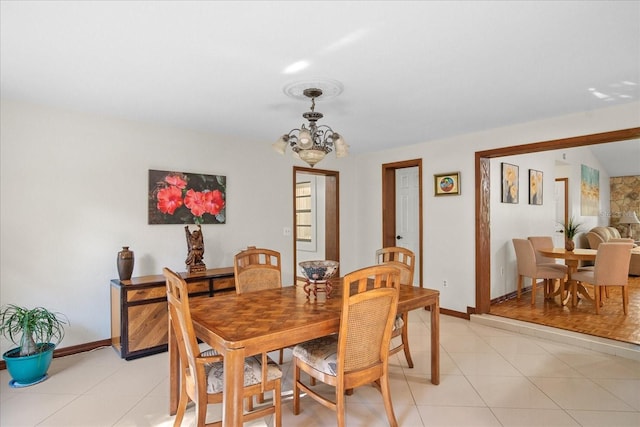 1273 Scrub Jay Trl, Frostproof, FL 33843 - dining room with a chandelier and baseboards