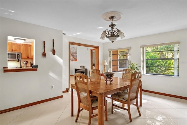 1273 Scrub Jay Trl, Frostproof, FL 33843 - dining space featuring a chandelier and light tile patterned floors
