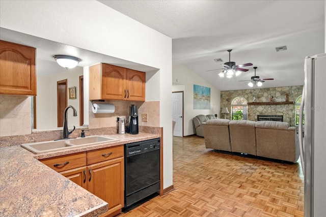 1273 Scrub Jay Trl, Frostproof, FL 33843 - kitchen with dishwasher, lofted ceiling, light countertops, a ceiling fan, and open floor plan