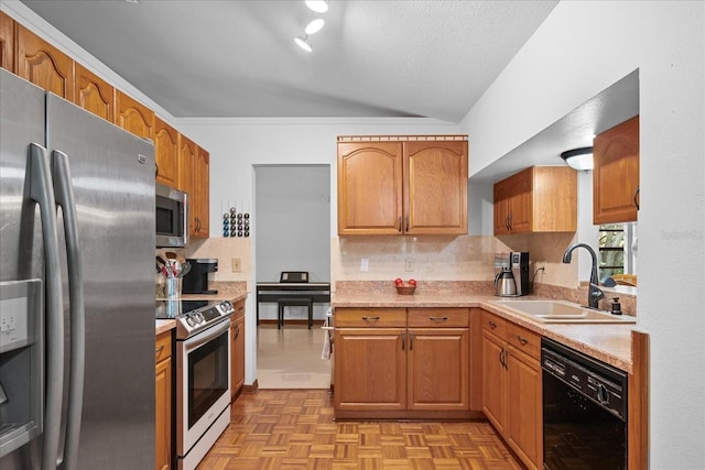 1273 Scrub Jay Trl, Frostproof, FL 33843 - kitchen featuring stainless steel appliances, lofted ceiling, backsplash, light countertops, and brown cabinetry
