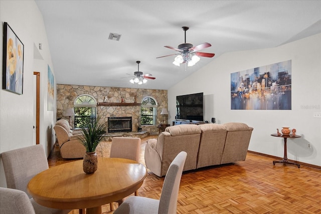 1273 Scrub Jay Trl, Frostproof, FL 33843 - dining room with a ceiling fan, lofted ceiling, and a fireplace