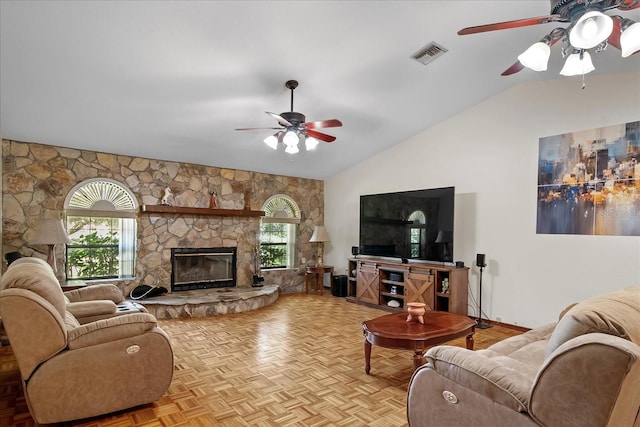 1273 Scrub Jay Trl, Frostproof, FL 33843 - living area with a ceiling fan, vaulted ceiling, and a stone fireplace