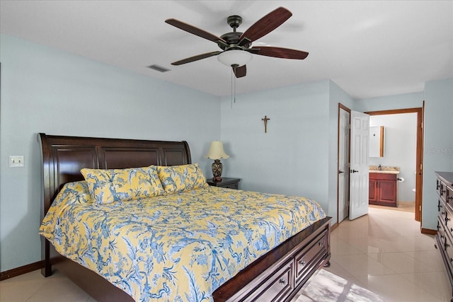 1273 Scrub Jay Trl, Frostproof, FL 33843 - bedroom with light tile patterned flooring, ceiling fan, and ensuite bath