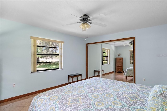 1273 Scrub Jay Trl, Frostproof, FL 33843 - bedroom featuring light tile patterned flooring, a closet, and ceiling fan