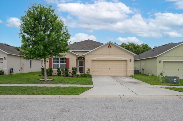 536 Squires Grove Dr, Winter Haven, FL 33880 - view of front of house with driveway, an attached garage, a front yard, and stucco siding