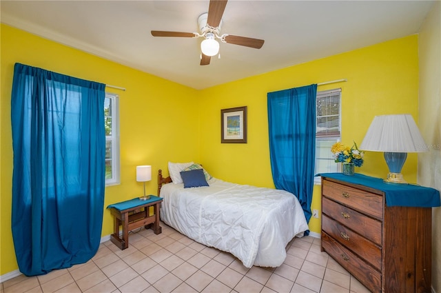 304 W Lake Ave, Auburndale, FL 33823 - bedroom featuring light tile patterned flooring, a ceiling fan, and baseboards
