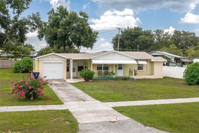 304 W Lake Ave, Auburndale, FL 33823 - ranch-style house with covered porch, an attached garage, driveway, and a shingled roof