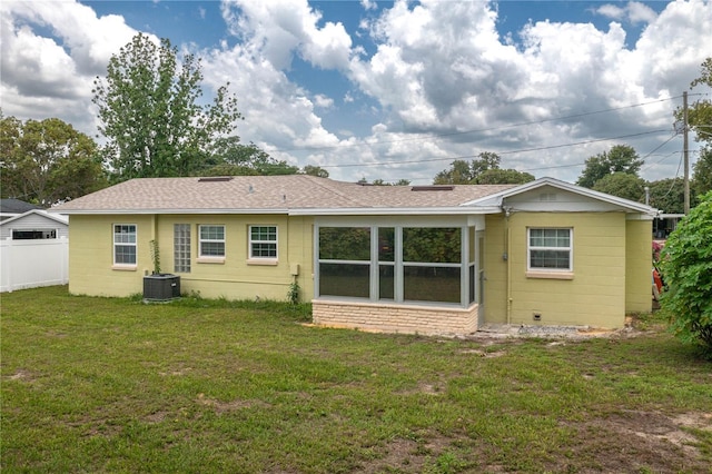 304 W Lake Ave, Auburndale, FL 33823 - rear view of house with concrete block siding, central AC unit, and roof with shingles