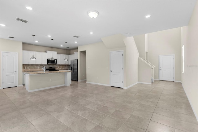7247 Oakmoss Loop, Davenport, FL 33837 - kitchen with appliances with stainless steel finishes, open floor plan, light tile patterned floors, and recessed lighting