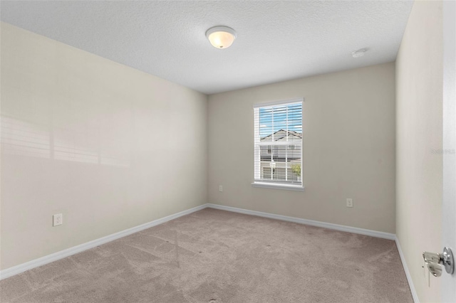 7247 Oakmoss Loop, Davenport, FL 33837 - spare room featuring carpet floors, baseboards, and a textured ceiling