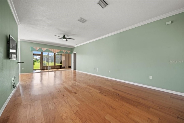 4254 Berwick Dr, Lake Wales, FL 33859 - spare room with a textured ceiling, a ceiling fan, ornamental molding, and wood finished floors
