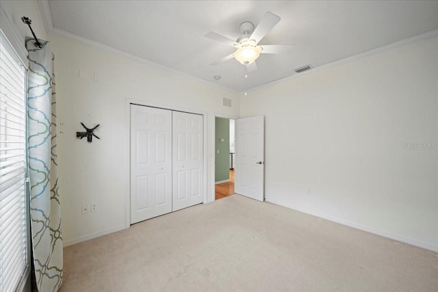4254 Berwick Dr, Lake Wales, FL 33859 - unfurnished bedroom with ornamental molding, carpet, a closet, and a ceiling fan